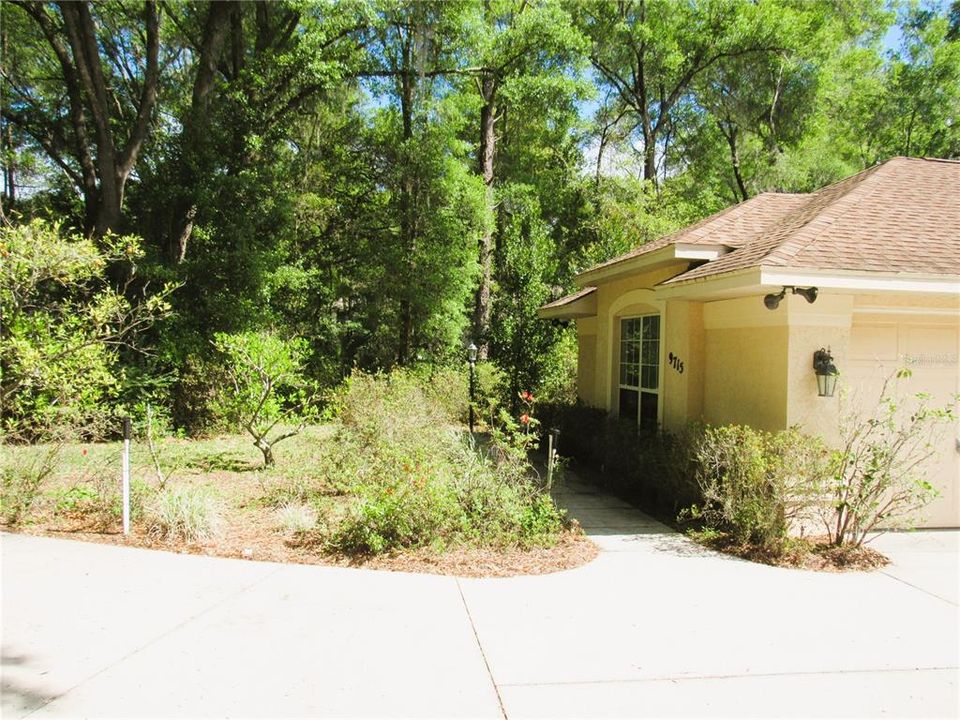 Immaculate One-Owner Home Beautifully Nestled on 1.04 Acres With Native Trees & Secret Garden's!