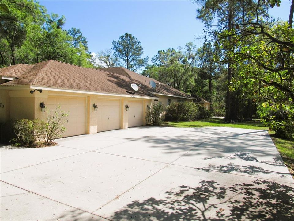 Extended 3-Car Side-Entry Garage With Huge Turn-Pad.