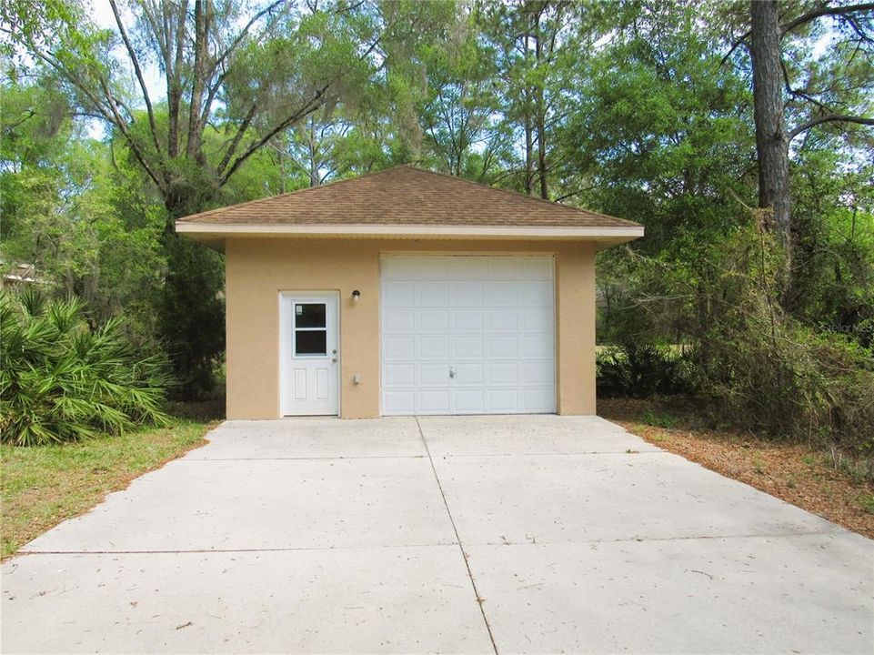 20 x 26 Detached Garage w/ Concrete Drive Way Show Cased Beautifully In Rear Of Property.