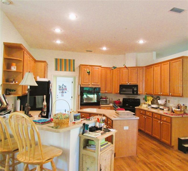 Another View Of This Smartly Designed Kitchen w/ Large Pantry with Organizer, Pull-Out Drawers and Lot's Of Maple Wood Cabinets!