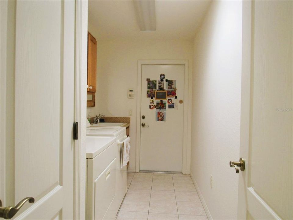 Large In-Door Laundry Station w/ Spacious Miscellaneous Closet & Storage Cabinets.