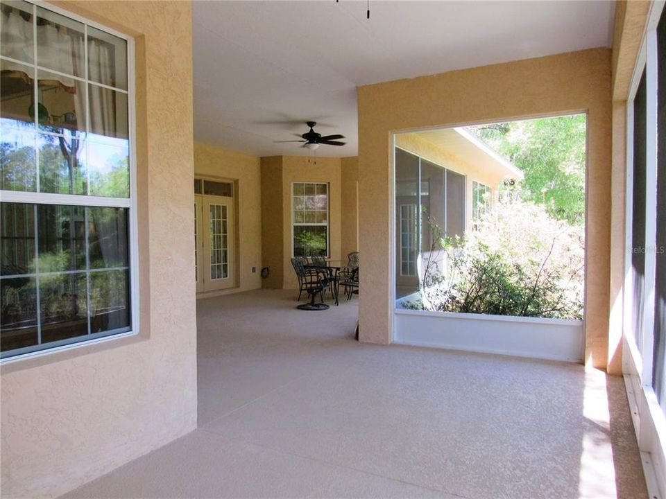 Voluminous Screen Enclosed Lanai w/ High Volume Ceiling and Acrylic Cool-Deck Floor.