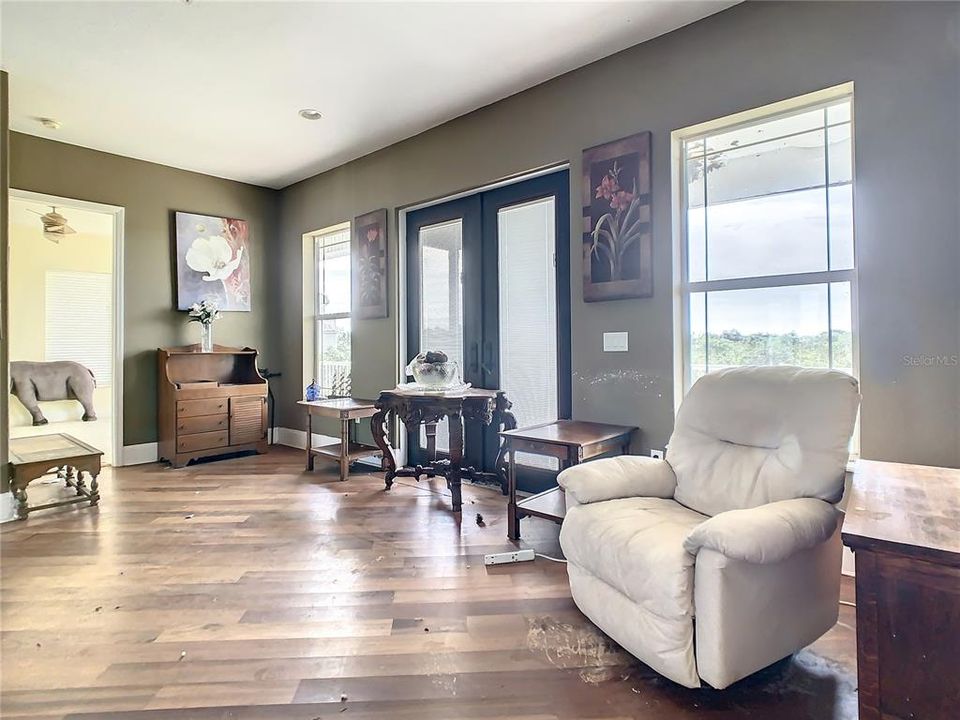 Living room, view toward bedroom 3, back deck to right