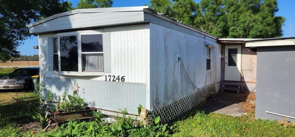 SINGLE WIDE MOBILE HOME FROM EAST SIDE
