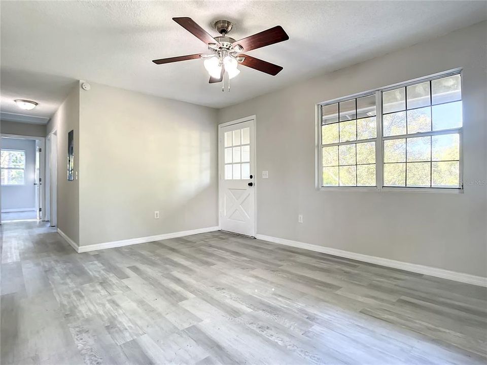 Living room & hallway leading to 3 bedrooms & bathroom