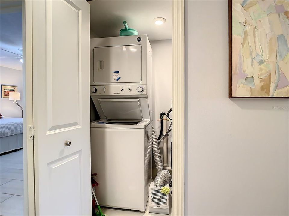 Washer Dryer inside the unit. This utility closet holds the w/d, the water heater and the electric panel.