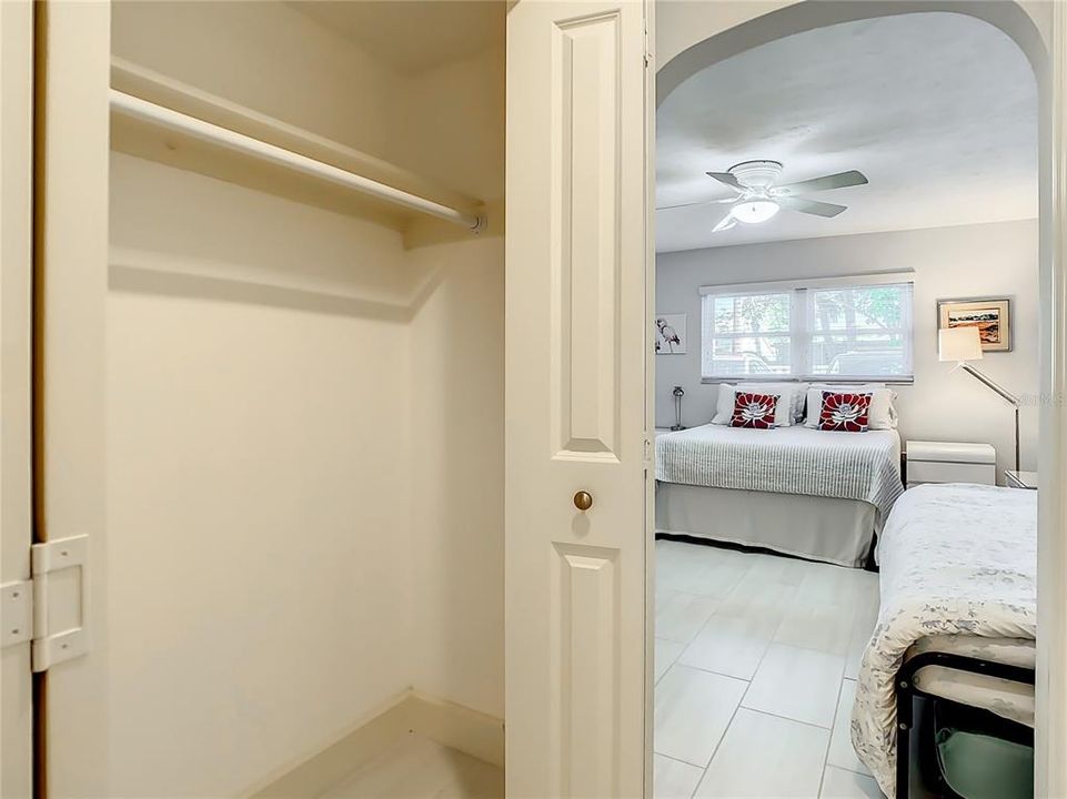 Double closet space in hallway from primary bedroom to its bathroom.
