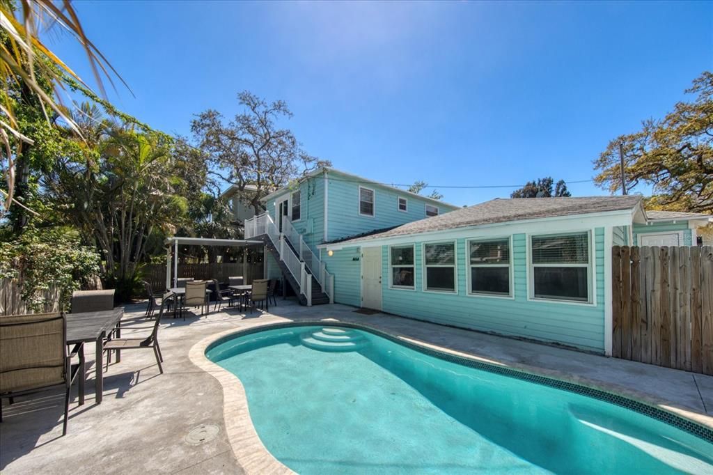 Large sundeck has areas to sunbathe, relax and enjoy outdoor cookouts and a dip in the pool!