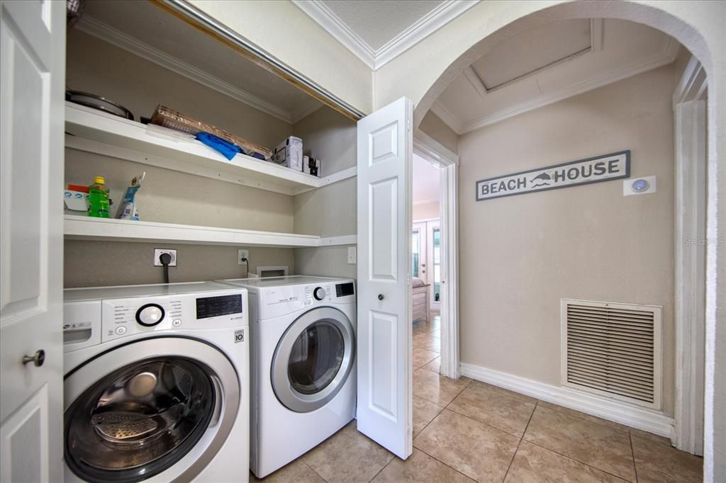Ground level full sized washer and dryer.