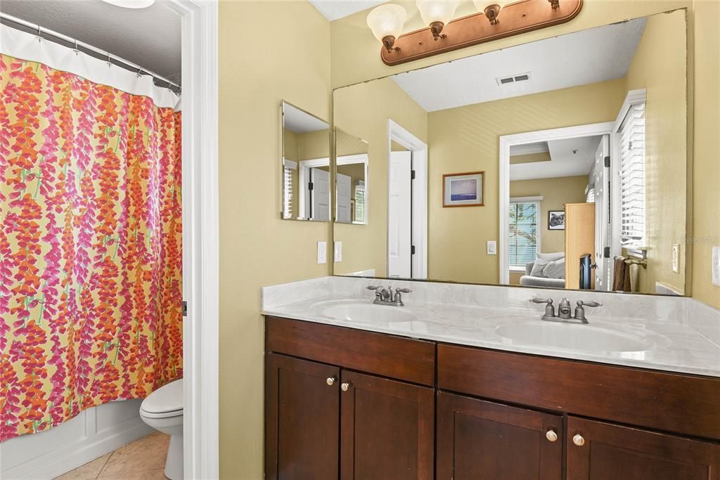 Master Bathroom with Dual Sinks and a tub/shower combo