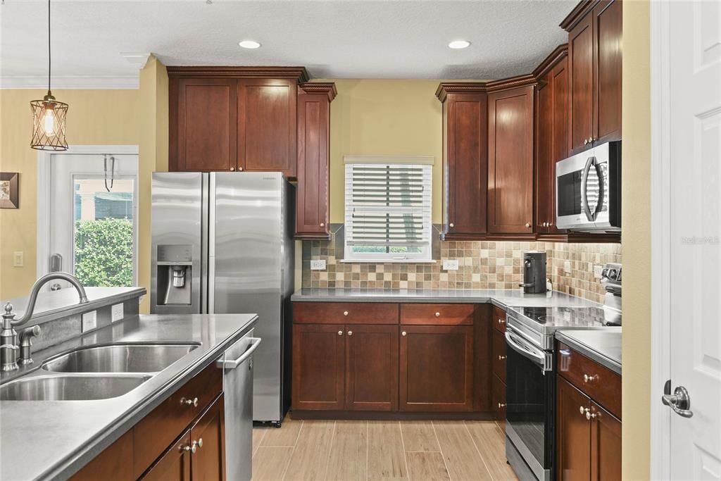 Lots of Space in the kitchen w/Cherry Cabinets and Stainless Steel Appliances