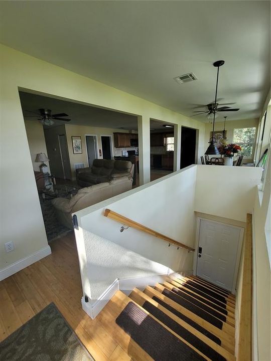 As you enter the house you are greeted by an open space living area.