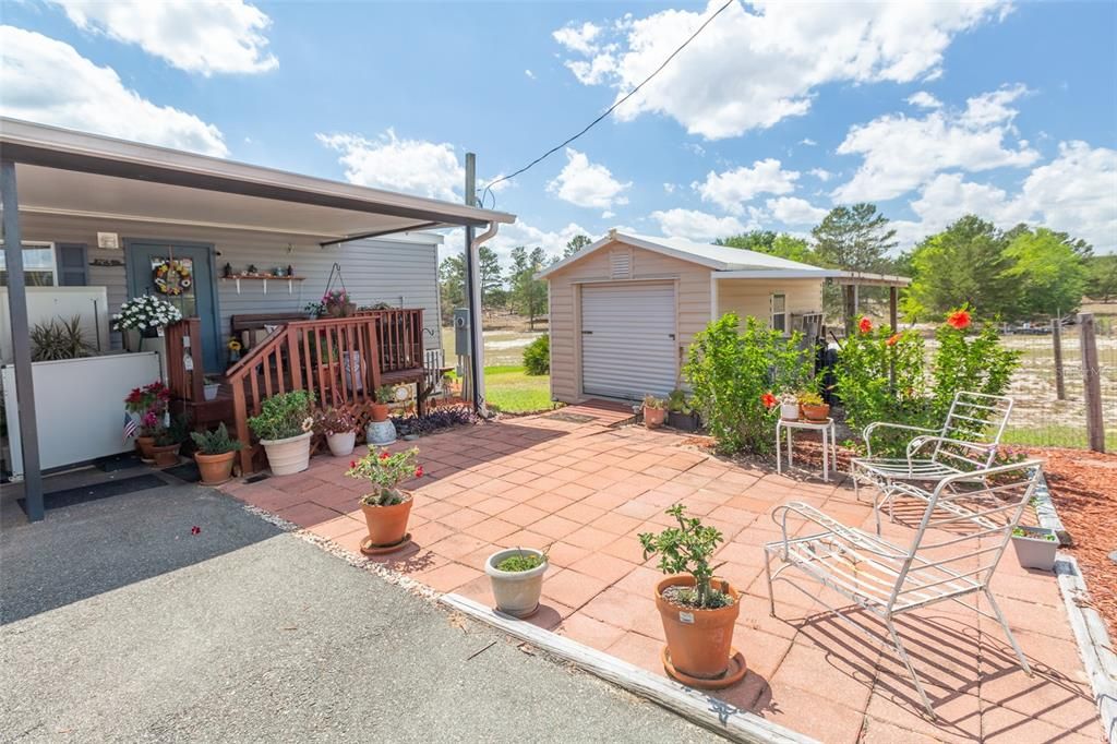 This shows the sitting area and storage shed.