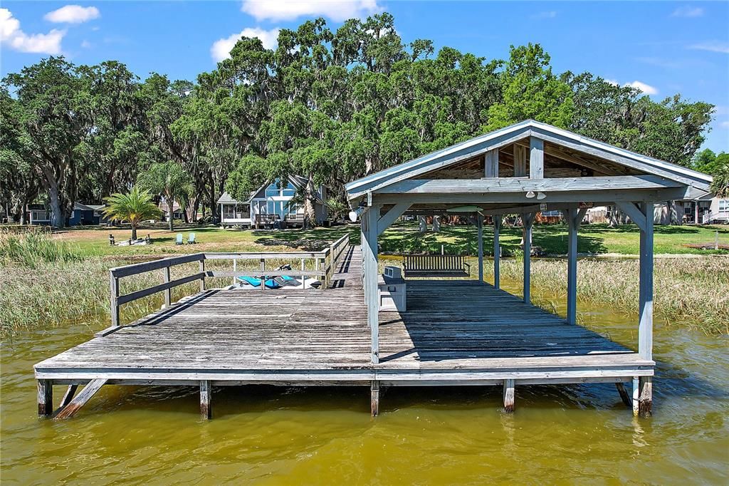 Covered boat dock with additional deck space for entertaining!