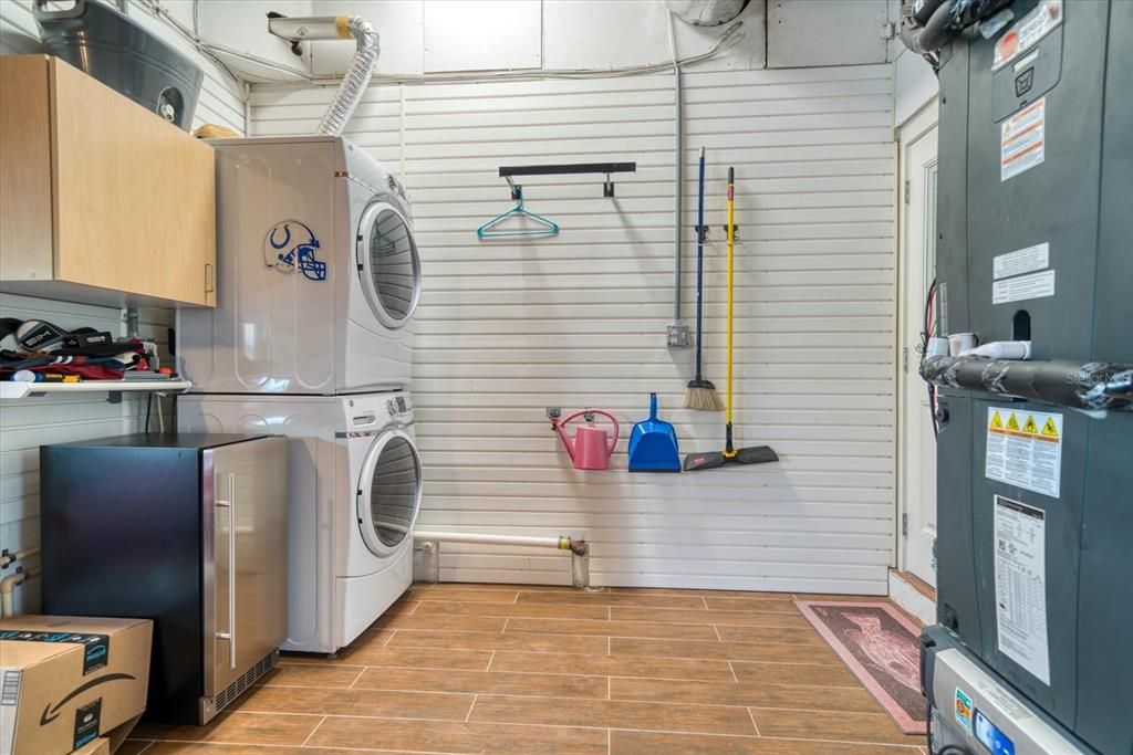 Laundry area with shelving system.