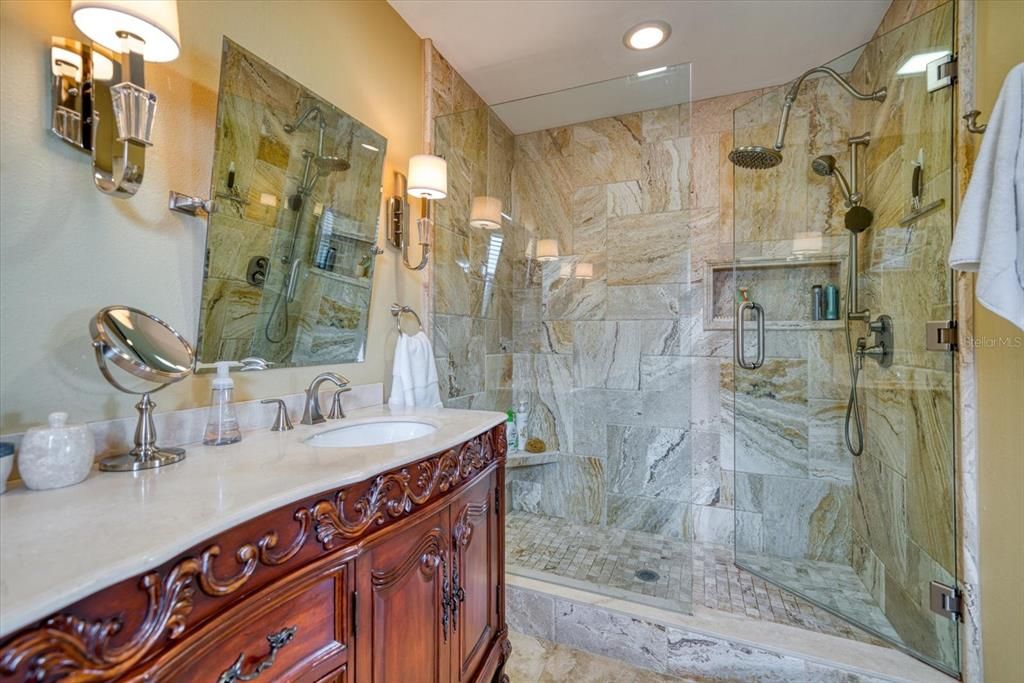 Primary bath area-details are abundant from the intricate vanities, lighting and much more.