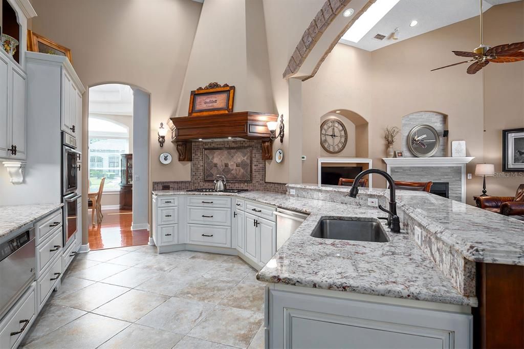 Kitchen open to the family room with gas fireplace