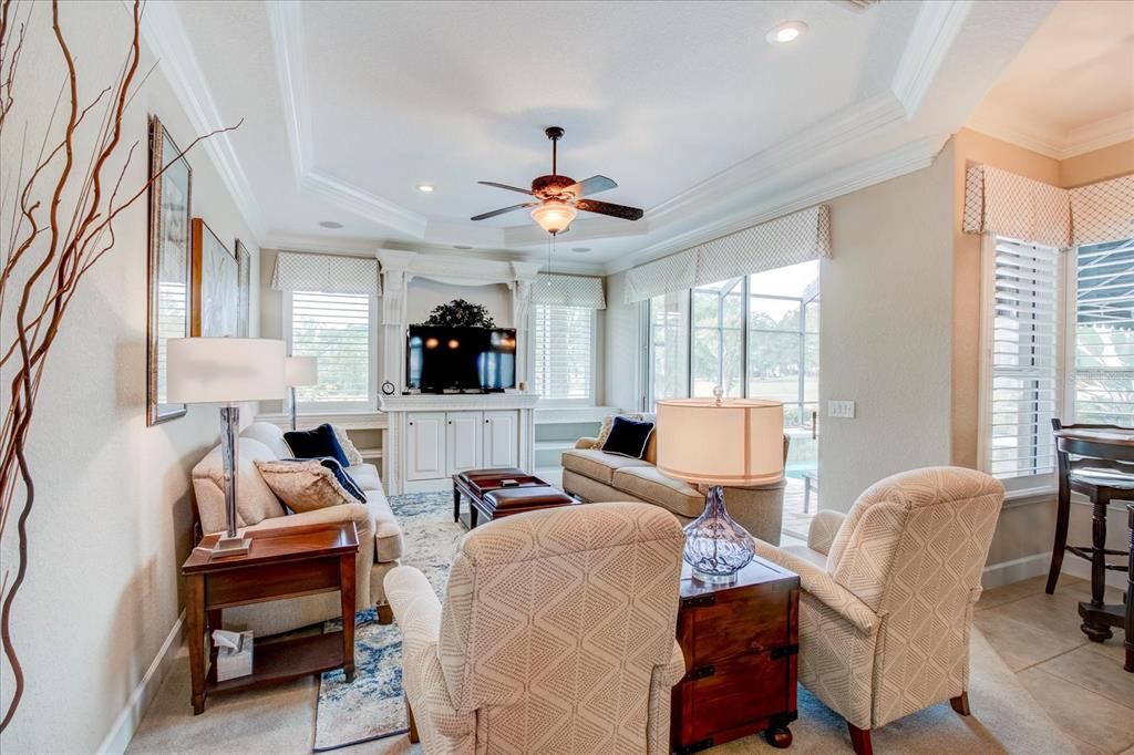 Family room with beautiful views and Norman plantation shutters.