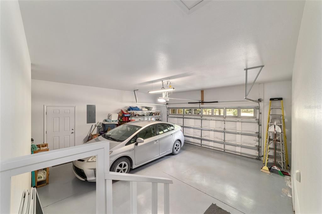 2 ca garage with insulated door and painted floors