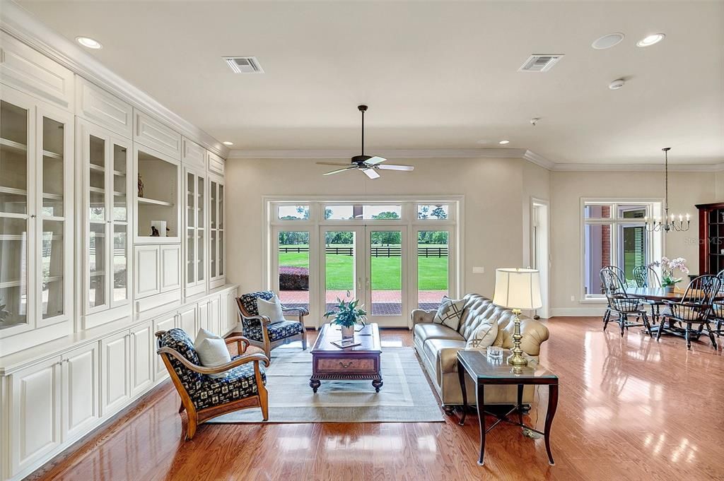 Family room- custom, reversible built-ins offer hidden seasonal decor storage