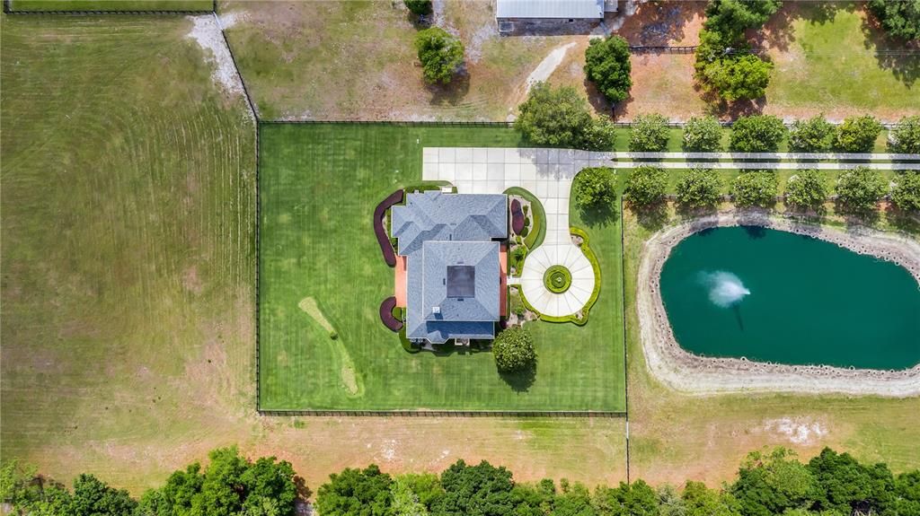 Birds eye view of the estate & the stocked pond with fountain