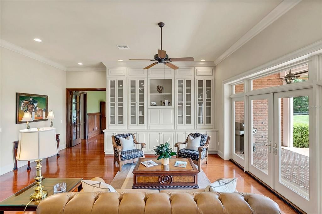 Family room with high ceilings backs up to the den/billiard room