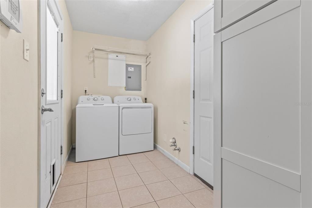 Laundry Room Off of Kitchen w/Built In Shelves for Storage
