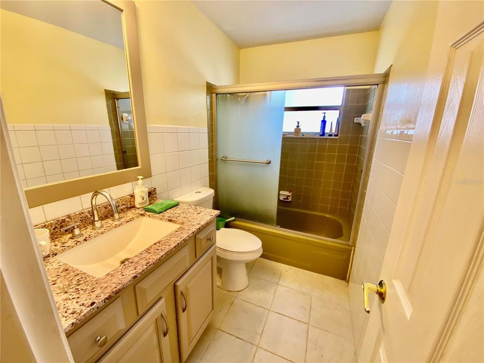 REMODELED GUEST BATH WITH GRANITE COUNTERTOP