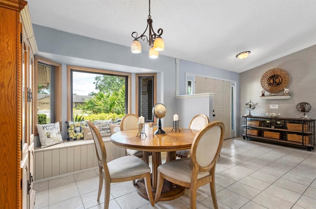 Dining Area just to the right of the entryway and Kitchen