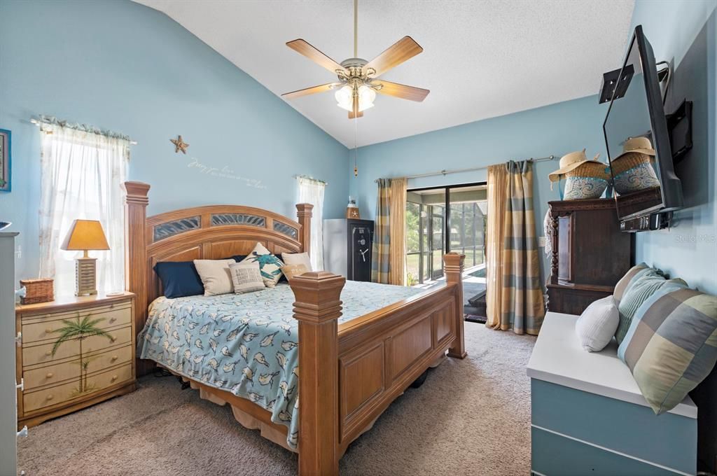 Primary Bedroom with vaulted ceiling and sliders to the Lanai