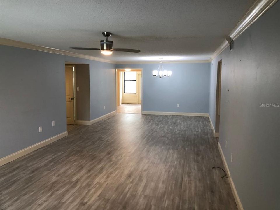 Living and dining area to kitchen.