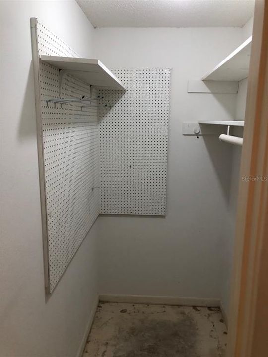 First storage closet off of living and dining area.