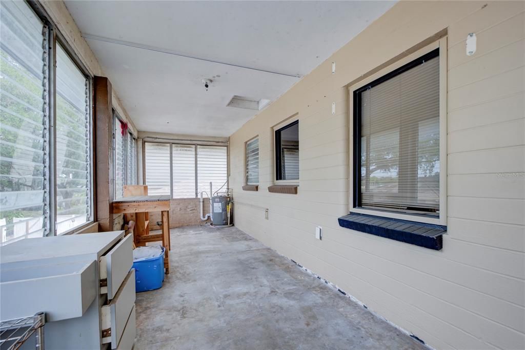 porch on upper 2 bedroom unit w/ laundry hookups at end