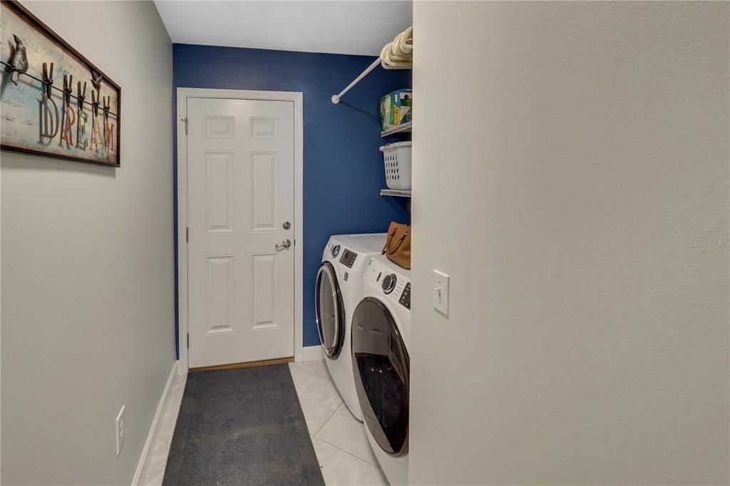THE LAUNDRY ROOM HAS ACCESS TO THE GARAGE AND IS OFF THE LIVING ROOM