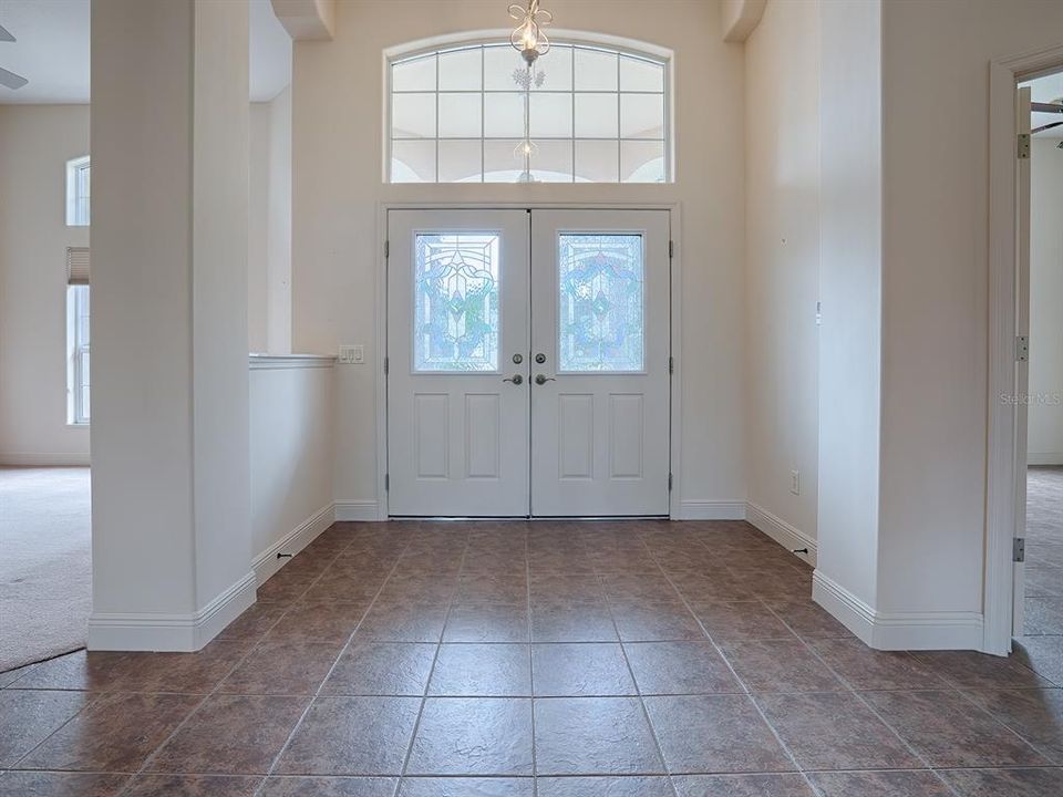 DOUBLE DOOR ENTRY WITH LEADED GLASS! CERAMIC TILE IN THE FOYER, WALKWAY AND GUEST BEDROOM/OFFICE TO YOUR RIGHT.