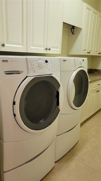 laundry with storage and sink