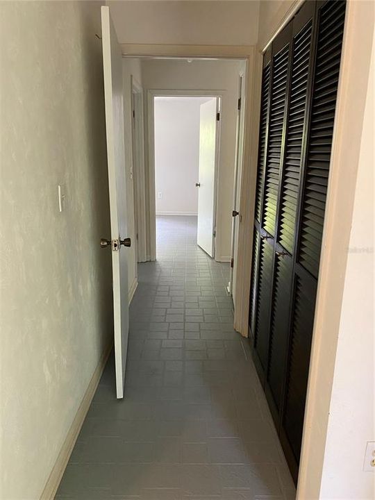 Hallway to two bedrooms and guest bathroom