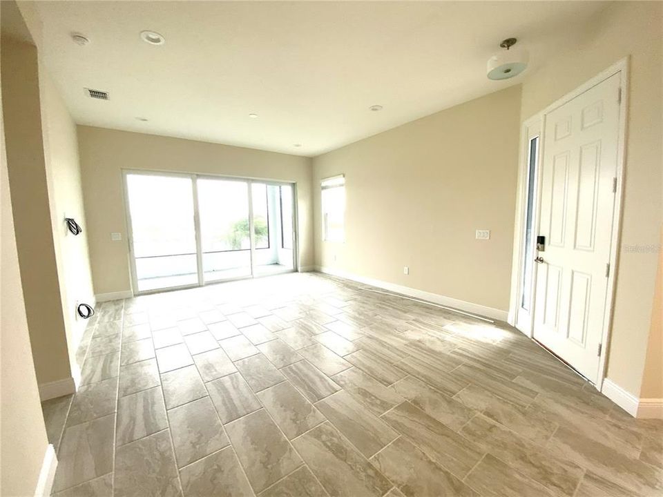 The living area opens to lanai with view