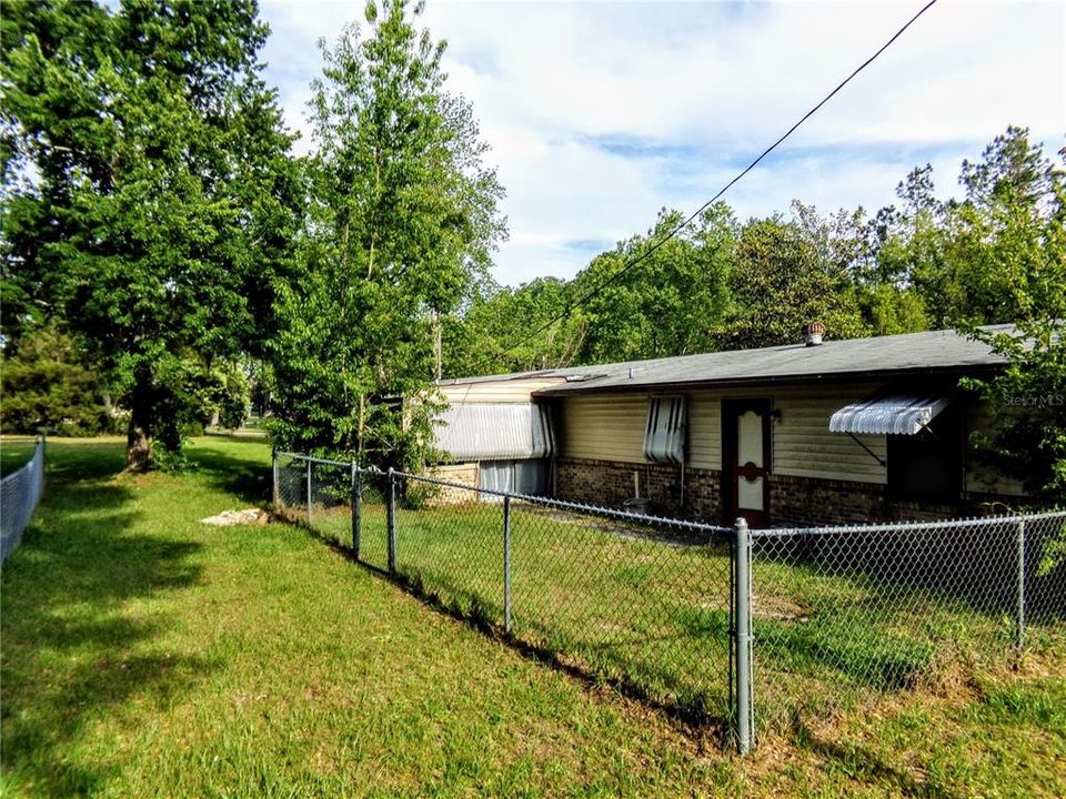 Exterior from back yard (garage side of home)