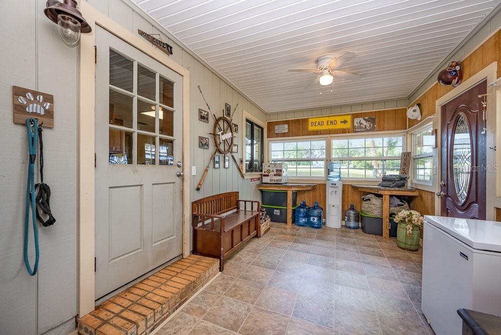 Nice enclosed front porch!