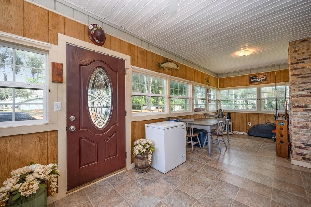 Really nice enclosed front porch!