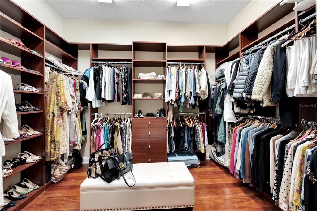 1 of 2 master closets with built-in shelves