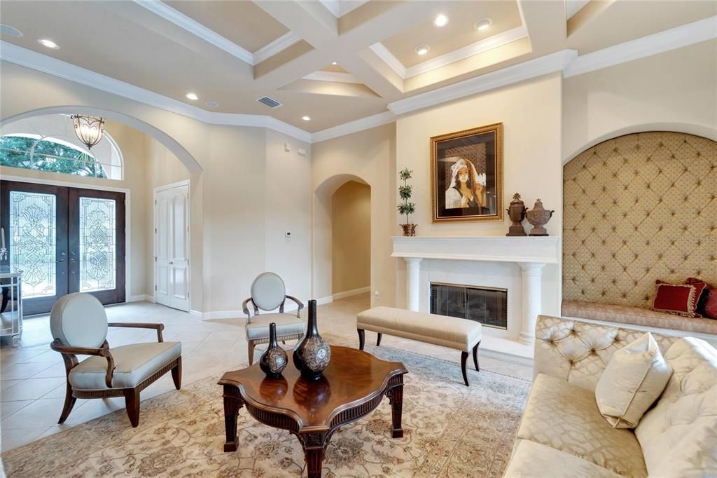 Living room with gas fireplace, coffered ceiling