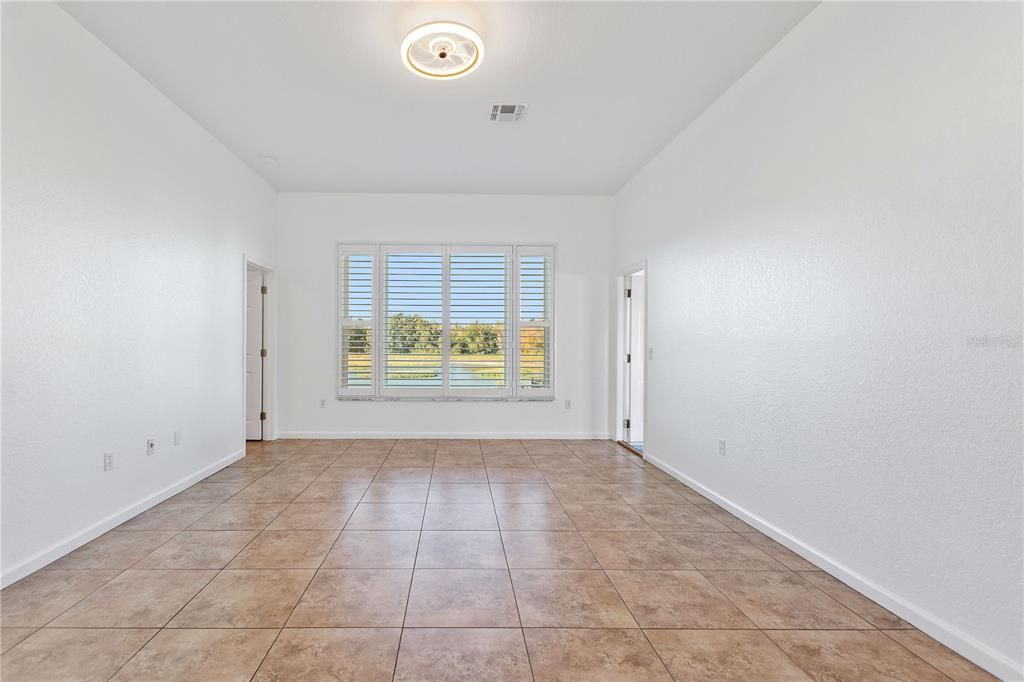 LIving room with panoramic view of the pond