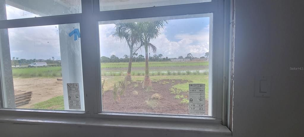 Primary bedroom window and gorgeous view of interior pond