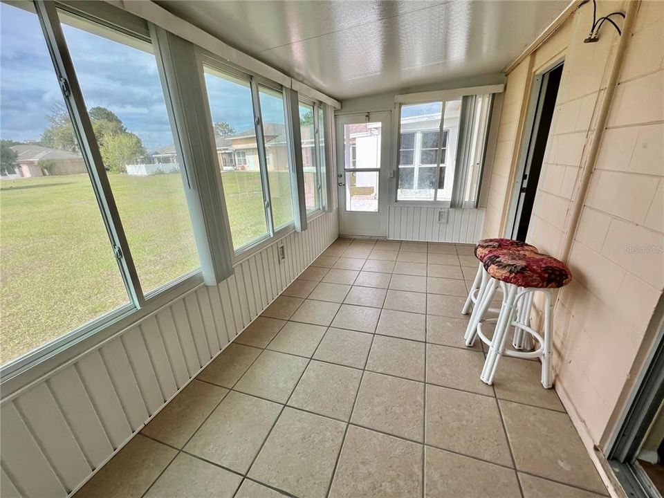 Florida room with double sided  hurricane doors.