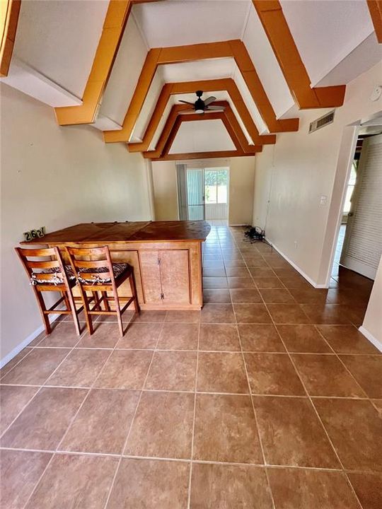 Fixed table counter dividing family and living room.