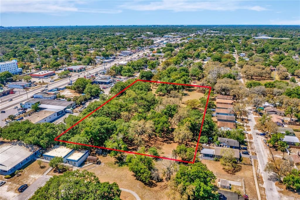 Aerial view from back of the property and adjacent businesses along Hillsborough Ave