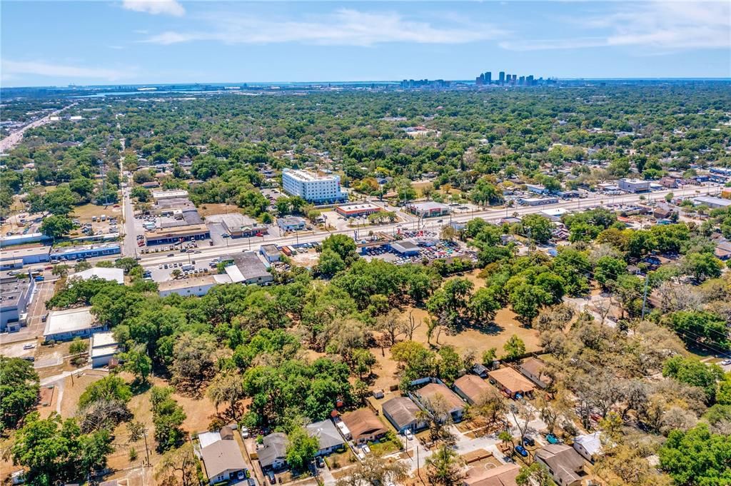 Aerial of property from back left view; Hillsborough Avenue & downtown Tampa view