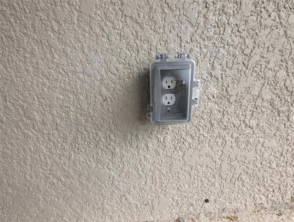 Electrical outlet #2 with TV cable on covered lanai in backyard